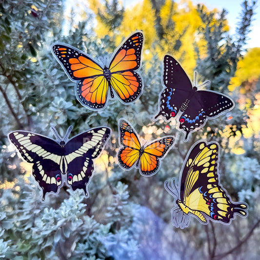 Colorful butterfly stickers on a blurred natural background